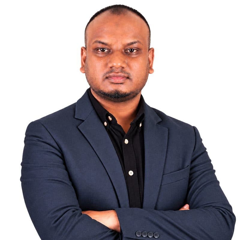 Md Alqurayish Sharkar, founder of ScanRoster, in a navy blazer with arms crossed